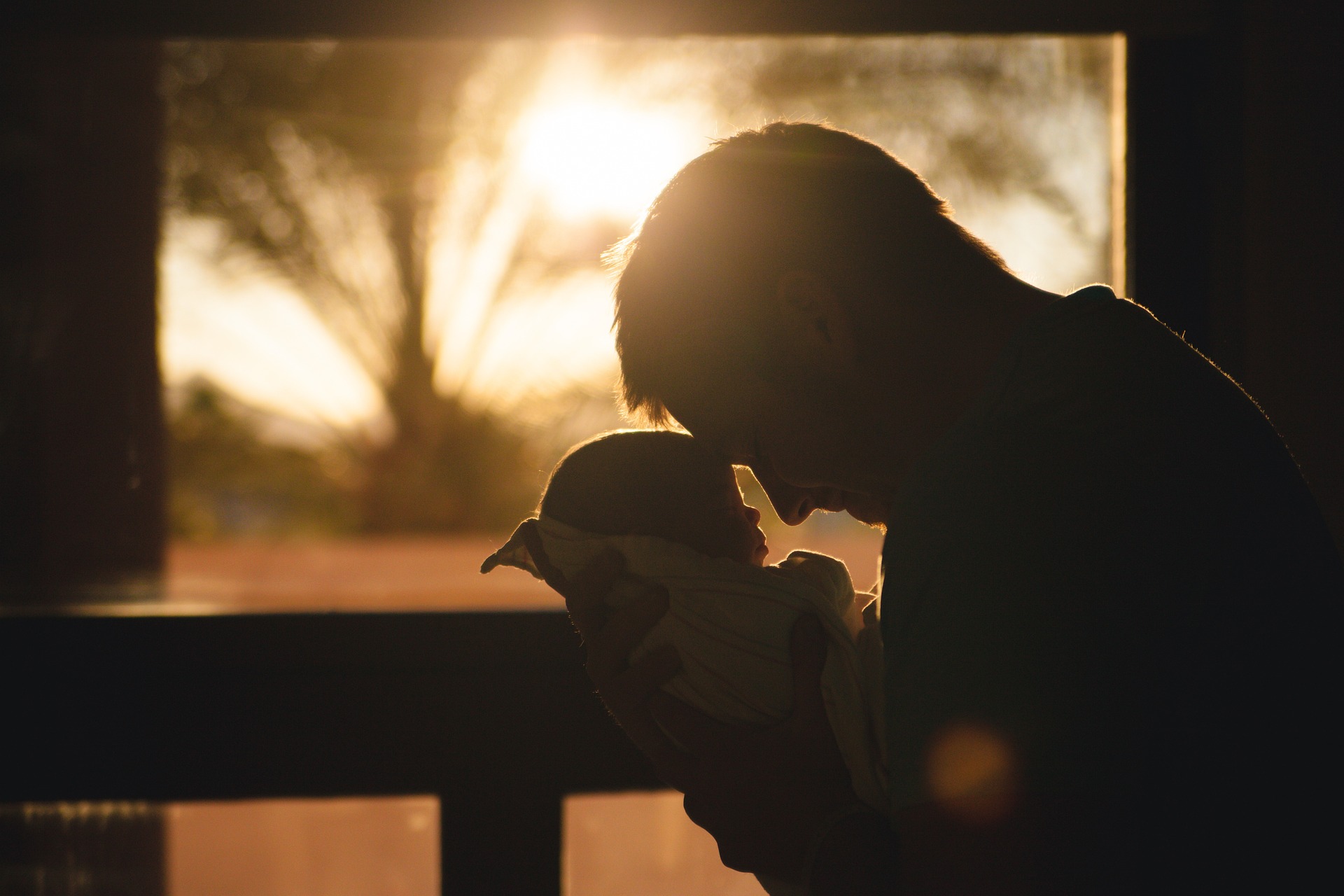 image of Father holding child